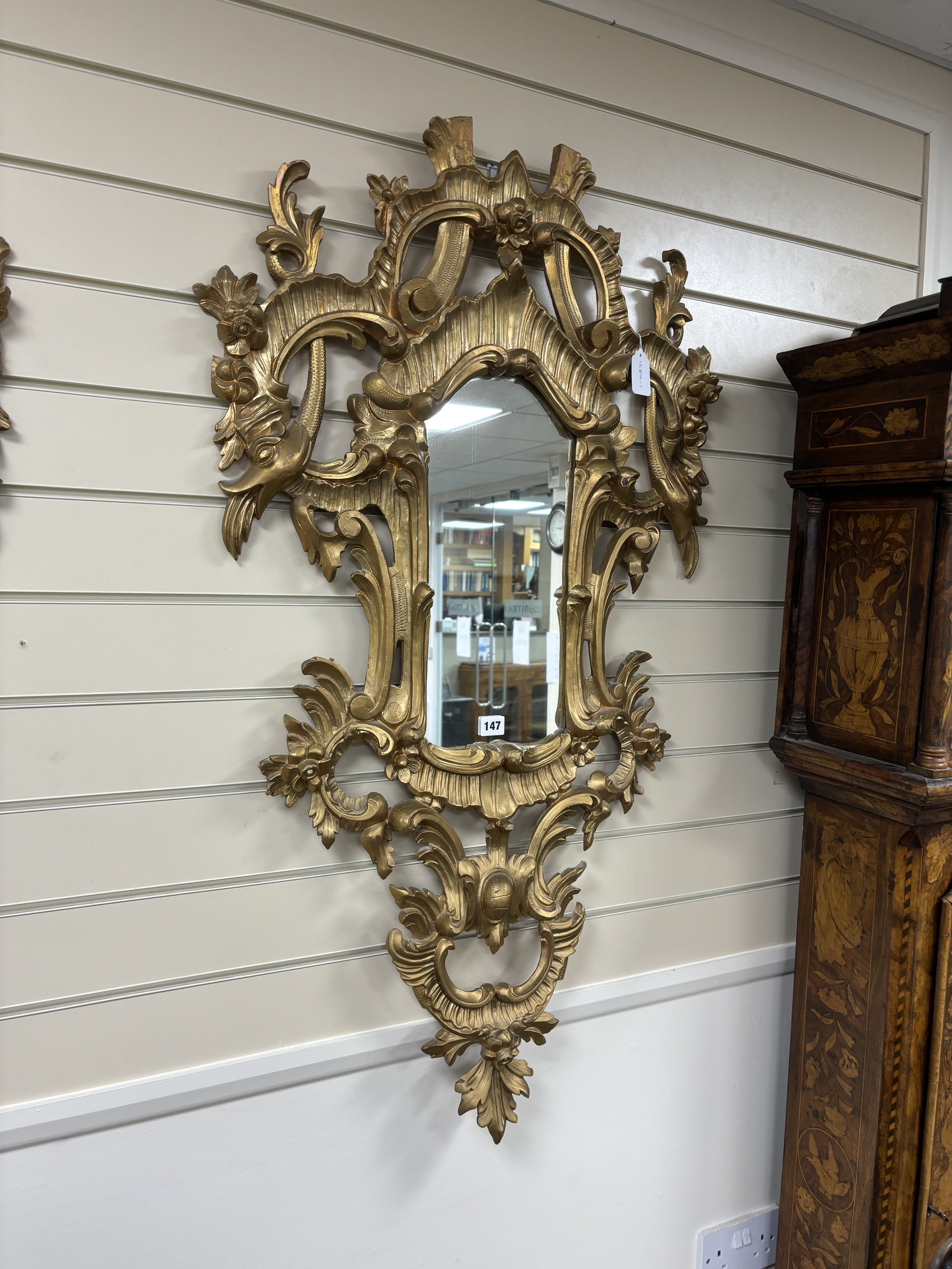 A pair of 18th century style carved giltwood wall mirrors, width 64cm, height 114cm